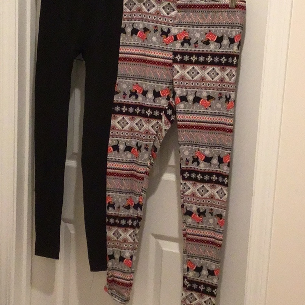 Women’s Time & Tru 2 pi fleece leggings 1 black 1 holiday pattern. Size medium